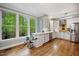 Bright kitchen with white cabinetry, hardwood floors, stainless steel appliances, and beautiful natural light at 105 Gorge Ct, Cary, NC 27518