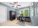 Bright office space with a ceiling fan, a desk, and natural light from the window at 105 Gorge Ct, Cary, NC 27518