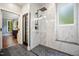 Elegant shower with marble tile, a glass enclosure, and a rainfall showerhead at 105 Gorge Ct, Cary, NC 27518