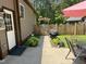 Back yard featuring patio area, and well kept landscaping at 105 Perry Ln, Zebulon, NC 27597