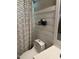 Bathroom featuring a toilet and a shower curtain with a white horizontal pattern at 105 Perry Ln, Zebulon, NC 27597