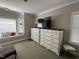 Bedroom with neutral walls, carpet, and dressers with lots of storage at 105 Perry Ln, Zebulon, NC 27597