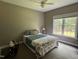 Cozy bedroom with a large window and ceiling fan at 105 Perry Ln, Zebulon, NC 27597