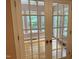 Elegant French doors with glass panes open into a bright room with wood floors at 105 Perry Ln, Zebulon, NC 27597