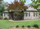 Well-maintained home with mature landscaping and inviting curb appeal at 105 Perry Ln, Zebulon, NC 27597