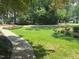 Beautifully manicured front lawn and walkway leading to a charming residence at 105 Perry Ln, Zebulon, NC 27597