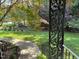 Well-maintained front yard and landscaped garden beds as seen from the porch at 105 Perry Ln, Zebulon, NC 27597