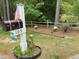 Charming front yard with a decorative mailbox, and flowering plants enhance the curb appeal at 105 Perry Ln, Zebulon, NC 27597