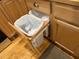 Cleverly designed kitchen cabinet with built-in trash cans, offering convenience and space-saving efficiency at 105 Perry Ln, Zebulon, NC 27597