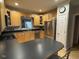 Well-lit kitchen featuring stainless steel appliances and sleek black countertops at 105 Perry Ln, Zebulon, NC 27597