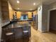 Spacious kitchen featuring stainless steel appliances, light wood cabinetry and black countertops at 105 Perry Ln, Zebulon, NC 27597