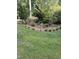 Landscaped garden bed featuring mature shrubbery at 105 Perry Ln, Zebulon, NC 27597
