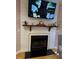 Comfortable living room showcasing a fireplace with a dark mantel and decor at 105 Perry Ln, Zebulon, NC 27597
