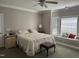 Bedroom with neutral colored walls, carpet, and an alcove with a window seat at 105 Perry Ln, Zebulon, NC 27597