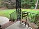 View of the cozy front porch with chairs and flowerpots, perfect for relaxing at 105 Perry Ln, Zebulon, NC 27597