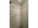 Tiled shower stall featuring neutral colored tile and a shower head at 105 Perry Ln, Zebulon, NC 27597