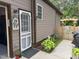 Side yard featuring a gate and stone planter box adding charm to the property at 105 Perry Ln, Zebulon, NC 27597