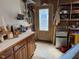 Organized workshop featuring cabinetry and a utility sink with exterior access at 105 Perry Ln, Zebulon, NC 27597