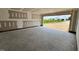A large two-car garage with exterior door, ready for finishing touches and providing direct access to the outdoors at 107 Lynn Ln, Selma, NC 27576