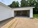 A spacious two-car garage with an open doorway, perfect for storing vehicles and other belongings at 107 Lynn Ln, Selma, NC 27576