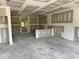 Spacious garage with drywall installed, offering ample space for parking and storage, plus a convenient interior door at 107 Lynn Ln, Selma, NC 27576