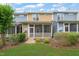 A backyard view showing a screened-in patio and garden area, perfect for outdoor living and entertaining at 108 Hundred Oaks Ln, Holly Springs, NC 27540