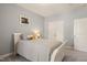 Cozy bedroom featuring a white bed frame, soft grey walls, and carpeted floors for a comfortable retreat at 108 Hundred Oaks Ln, Holly Springs, NC 27540
