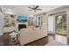 Bright living room featuring a fireplace, built-in shelving, and access to the outdoors at 108 Hundred Oaks Ln, Holly Springs, NC 27540