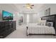 Main bedroom boasts tray ceiling, neutral carpet, dresser, and great natural light at 108 Hundred Oaks Ln, Holly Springs, NC 27540