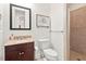 Bathroom featuring granite countertop, dark wood vanity, toilet, and tiled walk-in shower at 108 Teagan Ct, Chapel Hill, NC 27516