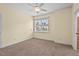This bedroom features a ceiling fan and a window that provides natural light at 108 Teagan Ct, Chapel Hill, NC 27516