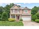 Charming two-story home with a manicured lawn, attached garage and beautiful landscaping at 108 Teagan Ct, Chapel Hill, NC 27516