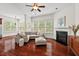 Bright living room with a fireplace, modern furniture, and lots of natural light at 108 Teagan Ct, Chapel Hill, NC 27516