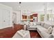 Inviting living space with a view into the kitchen, hardwood floors, and modern furniture at 108 Teagan Ct, Chapel Hill, NC 27516