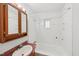 Standard bathroom features a sink with cabinet and a tub with white tile surround at 10900 Poole Rd, Wendell, NC 27591