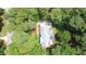 Aerial view showcasing a private wooded lot with a well-maintained home and inviting outdoor space at 12037 Deer Run, Raleigh, NC 27614