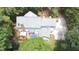 Birds eye view of home with backyard deck, driveway, and surrounded by mature trees at 12037 Deer Run, Raleigh, NC 27614