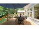 View of the back deck with an outdoor dining set, seating area, shade, and privacy at 12037 Deer Run, Raleigh, NC 27614