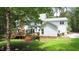 Spacious backyard with deck and mature trees providing shade and privacy for outdoor enjoyment at 12037 Deer Run, Raleigh, NC 27614