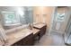 Elegant bathroom featuring double vanities, a soaking tub, and a separate glass shower at 12037 Deer Run, Raleigh, NC 27614