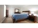 Bedroom featuring neutral walls, a cozy bed, and a window letting in natural light at 12037 Deer Run, Raleigh, NC 27614