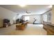 Bright bonus room featuring a home office, lounge area, and space for exercise equipment at 12037 Deer Run, Raleigh, NC 27614