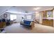 Spacious bonus room with built-in wet bar, desk area, and a comfortable sitting area at 12037 Deer Run, Raleigh, NC 27614