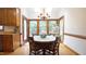 Bright breakfast nook with wood floors, large windows, and decorative chandelier at 12037 Deer Run, Raleigh, NC 27614