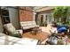 Spacious deck with cushioned seating, brick accents, and glass top tables ideal for outdoor relaxation and entertaining at 12037 Deer Run, Raleigh, NC 27614