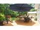 Relaxing backyard deck featuring a dining table set and views of a lush, landscaped yard at 12037 Deer Run, Raleigh, NC 27614