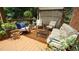 Relaxing deck area featuring comfortable seating, decorative plants, and a shaded pergola for outdoor enjoyment at 12037 Deer Run, Raleigh, NC 27614