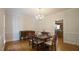 Traditional dining room featuring a chandelier, hardwood floors, and decorative molding at 12037 Deer Run, Raleigh, NC 27614