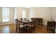 Formal dining room with a wooden table, chairs, and ample natural light at 12037 Deer Run, Raleigh, NC 27614