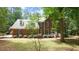 Traditional brick home with blue shutters and a well-maintained front yard at 12037 Deer Run, Raleigh, NC 27614